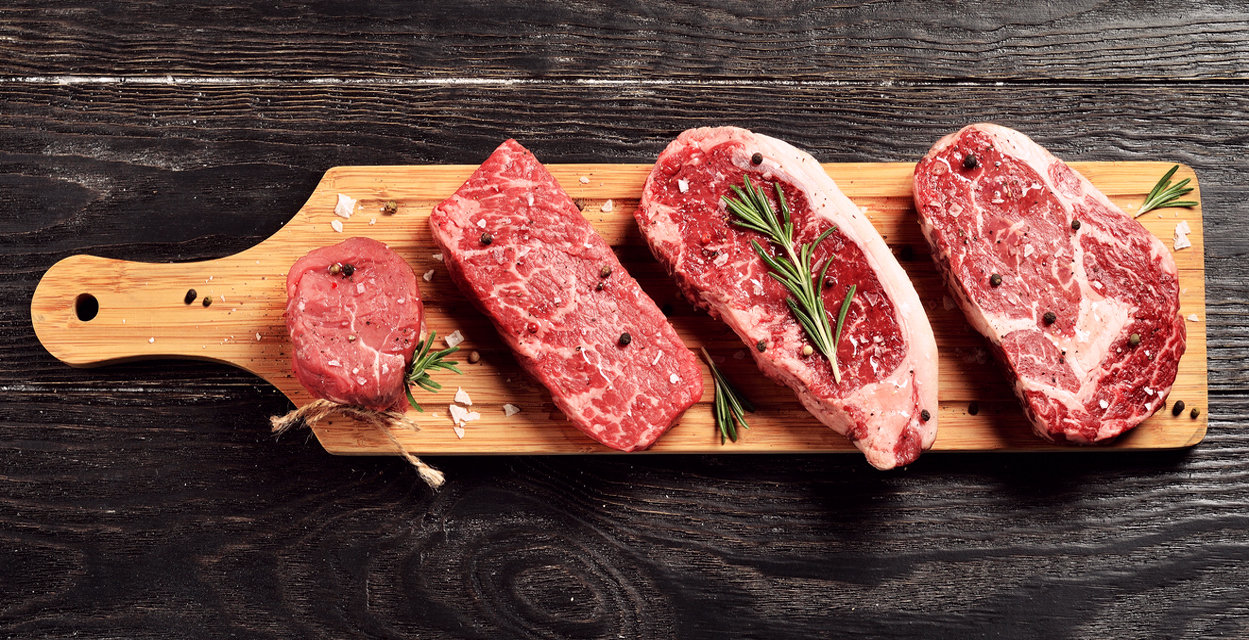Fresh cut steaks on a board at the Siemer Meat Market counter